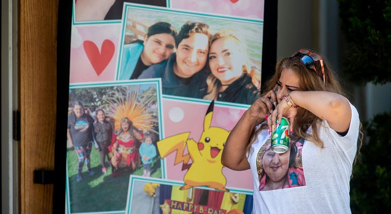 A mourner cries while attending a funeral for Keyla Salazar, 13, on Tuesday, Aug. 6, 2019, in San Jose, Calif. Salazar and two others were killed when a gunman opened fire at the Gilroy Garlic Festival July 28. Gilroy shooting memorial