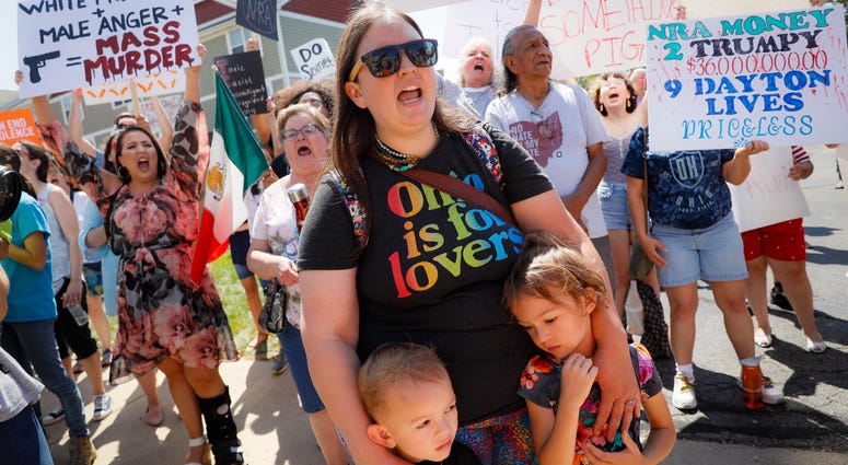 Demonstrators chant as they protest the arrival of President Donald Trump outside Miami Valley Hospital after a mass shooting that occurred in the Oregon District early Sunday morning, Wednesday, Aug. 7, 2019, in Dayton. Dayton shooting protesters