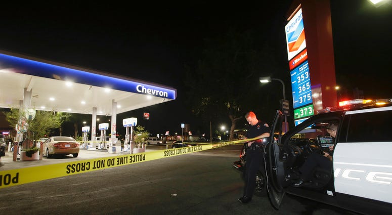 Garden Grove police stand watch at the scene of a stabbing in Garden Grove, Calif., Wednesday, Aug. 7, 2019. California stabbings