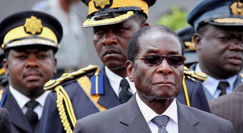 Zimbabwe President Robert Mugabe arrives for the burial of a prominent member of his party, Misheck Chando, in Harare, on Sat. Oct. 31, 2009. Zimbabwe President Robert Mugabe arrives for the burial of a prominent member of his party, Misheck Chando, in Harare, on Sat. Oct. 31, 2009.