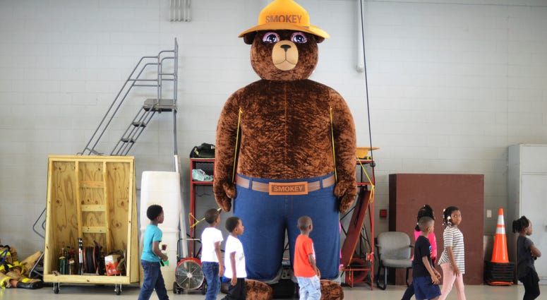 In this Wednesday, Oct. 11, 2017 file photo, a giant Smokey Bear statue greets children at the Fire Department Open House at Fire Station One in Kinston, N.C. In this Wednesday, Oct. 11, 2017 file photo, a giant Smokey Bear statue greets children at the Fire Department Open House at Fire Station One in Kinston, N.C.