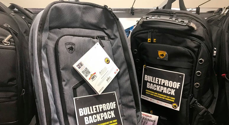 This Thursday, Aug. 8, 2019 photo shows bulletproof backpacks that for sale at an Office Depot store in Evanston, Ill. Bullet-resistant backpacks