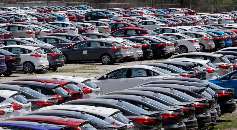 In this May 1, 2015, file photo Ford Focus vehicles are seen on a storage lot in Ypsilanti, Mich. Ford is extending the warranties on about 560,000 small cars to cover a litany of problems with a troubled six-speed automatic transmission. In this May 1, 2015, file photo Ford Focus vehicles are seen on a storage lot in Ypsilanti, Mich. Ford is extending the warranties on about 560,000 small cars to cover a litany of problems with a troubled six-speed automatic transmission.