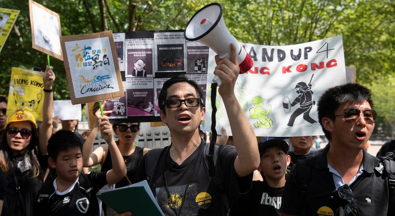 People gather in Lafayette Square in front of the White House in Washington, Sunday, Aug. 18, 2019, in solidarity with the "Stand With Hong Kong, Power to the People Rally" in Hong Kong. People gather in Lafayette Square in front of the White House in Washington, Sunday, Aug. 18, 2019, in solidarity with the "Stand With Hong Kong, Power to the People Rally" in Hong Kong.