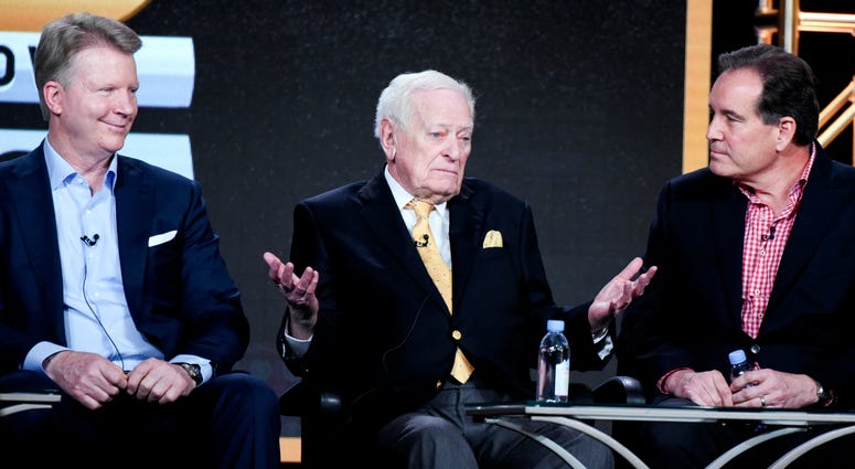 In this Jan. 12, 2016, file photo, from left to right, sportscasters Phil Simms, Jack Whitaker and Jim Nantz participate in the "CBS Sports" panel at the CBS 2016 Winter TCA in Pasadena, Calif. Jack Whitaker