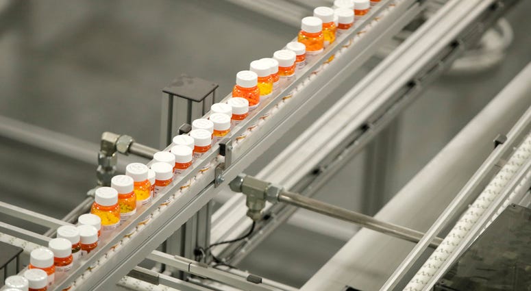 In this July 10, 2018, file photo bottles of medicine ride on a belt at a mail-in pharmacy warehouse in Florence, N.J. In this July 10, 2018, file photo bottles of medicine ride on a belt at a mail-in pharmacy warehouse in Florence, N.J.