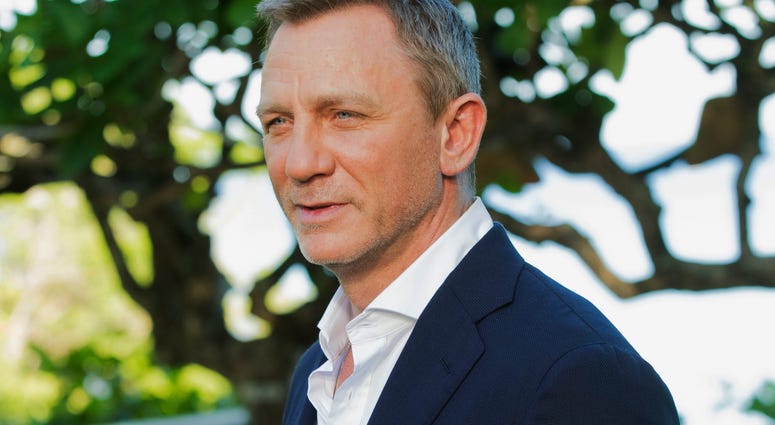 In this April 25, 2019, file photo, actor Daniel Craig poses for photographers during the photo call of the latest installment of the James Bond film franchise, in Oracabessa, Jamaica. In this April 25, 2019, file photo, actor Daniel Craig poses for photographers during the photo call of the latest installment of the James Bond film franchise, in Oracabessa, Jamaica.