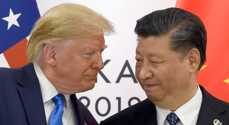 In this June 29, 2019, file photo, President Donald Trump, left, meets with Chinese President Xi Jinping during a meeting on the sidelines of the G-20 summit in Osaka, Japan. Donald Trump and China's Xi Jinping