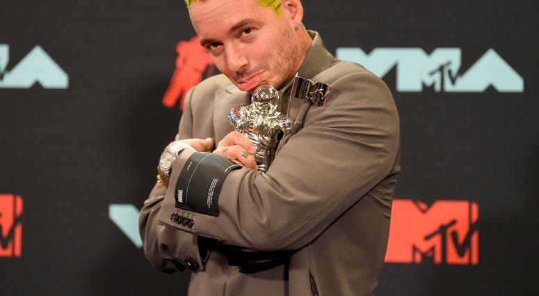 J Balvin poses in the press room with the award for best latin video for "Con Altura" at the MTV Video Music Awards at the Prudential Center on Monday, Aug. 26, 2019, in Newark, N.J. J Balvin poses in the press room with the award for best latin video for "Con Altura" at the MTV Video Music Awards at the Prudential Center on Monday, Aug. 26, 2019, in Newark, N.J.