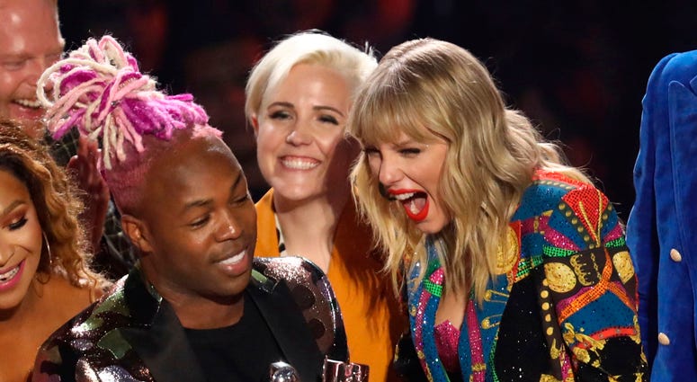 Taylor Swift, right, accepts the video for good award for "YouNeed to Calm Down" at the MTV Video Music Awards at the Prudential Center on Monday, Aug. 26, 2019, in Newark, N.J. Taylor Swift, right, accepts the video for good award for "YouNeed to Calm Down" at the MTV Video Music Awards at the Prudential Center on Monday, Aug. 26, 2019, in Newark, N.J.