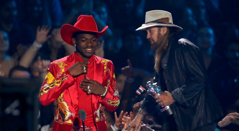 Lil Nas X, left, and Billy Ray Cyrus accept the song of the year award for "Old Town Road" at the MTV Video Music Awards at the Prudential Center on Monday, Aug. 26, 2019, in Newark, N.J. Lil Nas X, left, and Billy Ray Cyrus accept the song of the year award for "Old Town Road" at the MTV Video Music Awards at the Prudential Center on Monday, Aug. 26, 2019, in Newark, N.J.