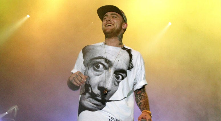 FILE - In this July 13, 2013, file photo, rapper Mac Miller performs on his Space Migration Tour in Philadelphia. Mac Miller on stage in 2013.