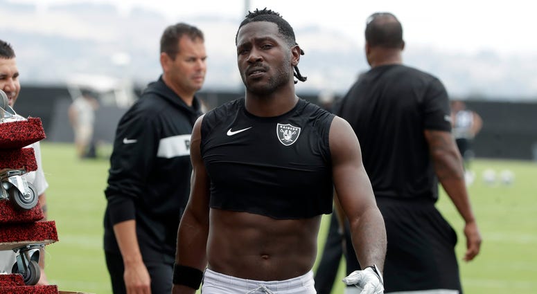 In this Aug. 20, 2019, file photo, Oakland Raiders' Antonio Brown walks off the field after NFL football practice in Alameda, Calif. Antonio Brown