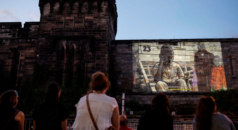 People view incarcerated filmmaker Robert's animated short titled "A Special Person" projected on the wall of Eastern State Penitentiary in Philadelphia. People view incarcerated filmmaker Robert's animated short titled "A Special Person" projected on the wall of Eastern State Penitentiary in Philadelphia.