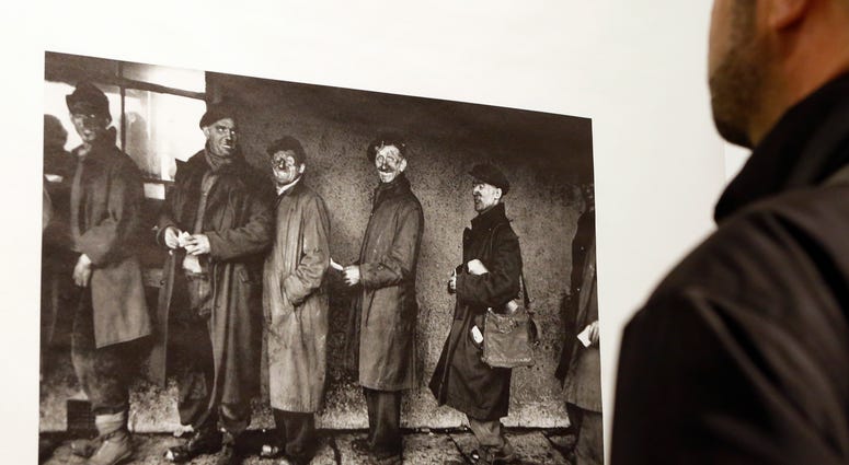 A man looks at a photograph by Robert Frank at the opening of the exhibition featuring Frank's work, "Robert Frank: Books and Films, 1947–2016," at New York University's Tisch School of the Arts in New York. A man looks at a photograph by Robert Frank at the opening of the exhibition featuring Frank's work, "Robert Frank: Books and Films, 1947–2016," at New York University's Tisch School of the Arts in New York.