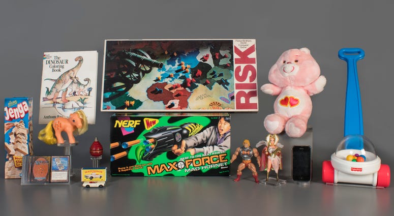 National Toy Hall of Fame 2019 finalists, from left to right: Jenga, Magic the Gathering, My Little Pony, Coloring Book, Matchbox Cars, Top, Nerf Blaster, Risk, Masters of the Universe, Care Bears, Smartphone, and Fisher-Price Corn Popper. National Toy Hall of Fame 2019 finalists