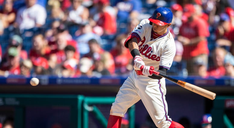 Philadelphia Phillies's Cesar Hernandez swings on a single during the sixth inning of a baseball game against the Boston Red Sox, Sunday, Sept. 15, 2019, in Philadelphia. Philadelphia Phillies's Cesar Hernandez swings on a single during the sixth inning of a baseball game against the Boston Red Sox, Sunday, Sept. 15, 2019, in Philadelphia.