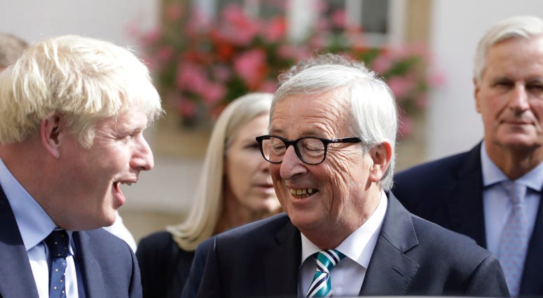 European Commission President Jean-Claude Juncker, center, speaks with British Prime Minister Boris Johnson, left, after a meeting in Luxembourg, Monday, Sept. 16, 2019. European Commission President Jean-Claude Juncker, center, speaks with British Prime Minister Boris Johnson, left, after a meeting in Luxembourg, Monday, Sept. 16, 2019.