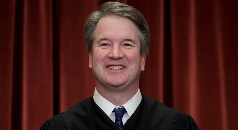 In this Nov. 30, 2018, file photo Associate Justice Brett Kavanaugh sits with fellow Supreme Court justices for a group portrait at the Supreme Court Building in Washington. Brett Kavanaugh