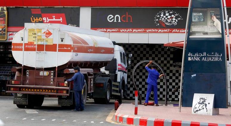 Workers refuel the tank at a gas station in Jiddah, Saudi Arabia, Tuesday, Sept. 17, 2019. Workers refuel the tank at a gas station in Jiddah, Saudi Arabia, Tuesday, Sept. 17, 2019.