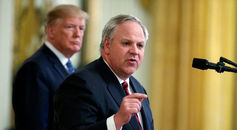 President Donald Trump listens as then-Secretary of the Interior David Bernhardt speaks during an event on the environment in the East Room of the White House in Washington. President Donald Trump listens as then-Secretary of the Interior David Bernhardt speaks during an event on the environment in the East Room of the White House in Washington.