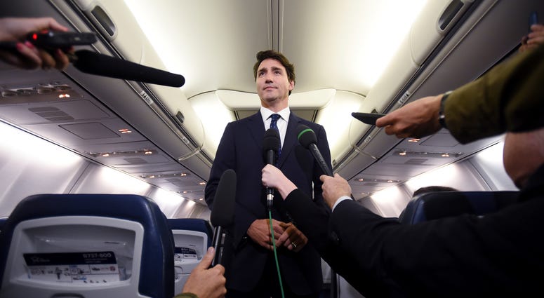 Canadian Prime Minister and Liberal Party leader Justin Trudeau makes a statement in regards to a photo coming to light of himself from 2001, wearing "brownface," during a scrum on his campaign plane in Halifax, Nova Scotia, Wednesday, Sept. 18, 2019. Canadian Prime Minister and Liberal Party leader Justin Trudeau makes a statement in regards to a photo coming to light of himself from 2001, wearing "brownface," during a scrum on his campaign plane in Halifax, Nova Scotia, Wednesday, Sept. 18, 2019.