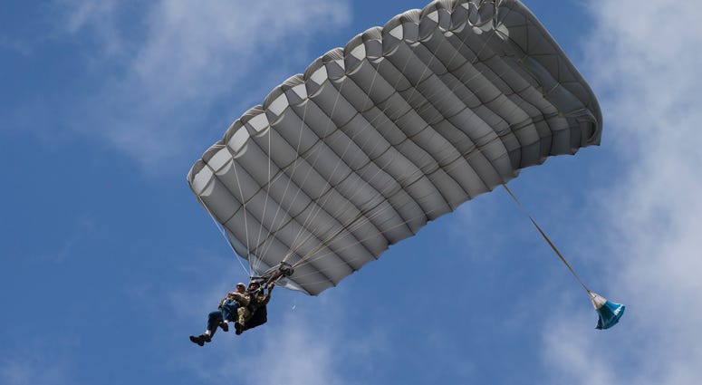 Tom Rice, a 98-year-old American WWII veteran, front left, approaches the landing zone during a tandem parachute jump near Groesbeek, Netherlands, Thursday, Sept. 19, 2019. Tom Rice, a 98-year-old American WWII veteran, front left, approaches the landing zone during a tandem parachute jump near Groesbeek, Netherlands, Thursday, Sept. 19, 2019.