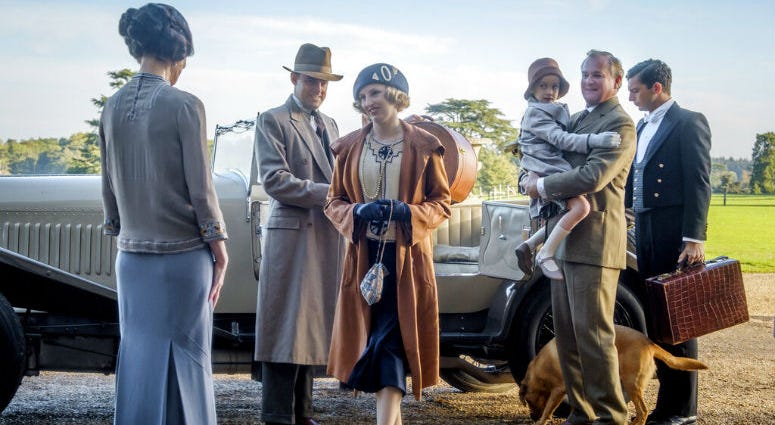 This image released by Focus Features shows Elizabeth McGovern, from left, Harry Hadden-Paton, Laura Carmichael, Hugh Bonneville and Michael Fox, right, in a scene from the film "Downton Abbey." This image released by Focus Features shows Elizabeth McGovern, from left, Harry Hadden-Paton, Laura Carmichael, Hugh Bonneville and Michael Fox, right, in a scene from the film "Downton Abbey."