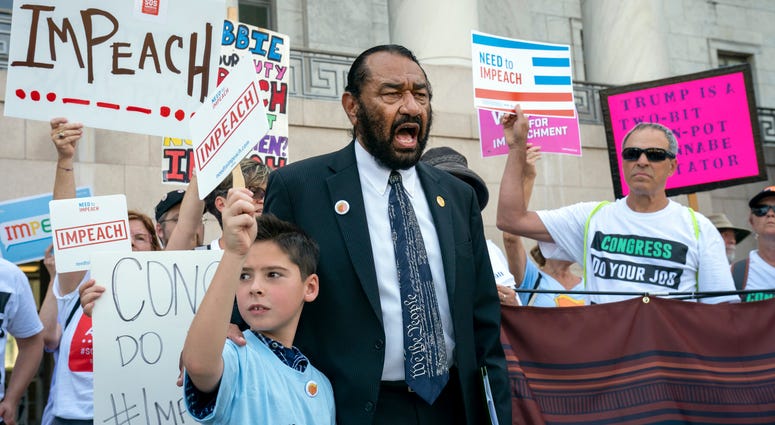 Rep. Al Green, D-Texas, joins impeachment activists with a youth-led group, By The People, to call for Congress to remove President Donald Trump from office, outside the Rayburn House Office Building on Capitol Hill in Washington, Monday, Sept. 23, 2019. Rep. Al Green, D-Texas, joins impeachment activists with a youth-led group, By The People, to call for Congress to remove President Donald Trump from office, outside the Rayburn House Office Building on Capitol Hill in Washington, Monday, Sept. 23, 2019.