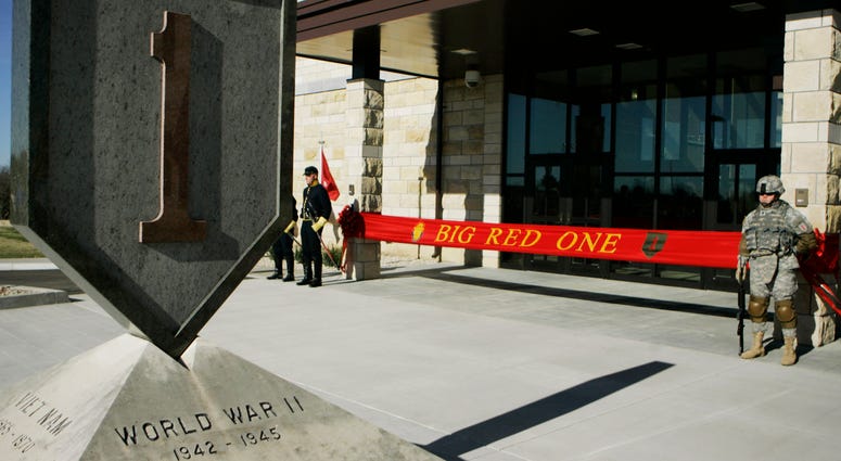 In this Feb. 9, 2015 file photo, an honor guard stands at the entrance before ribbon cutting ceremonies for the new 1st Infantry Division Headquarters at Fort Riley, Kan. 1st Infantry Division Headquarters at Fort Riley