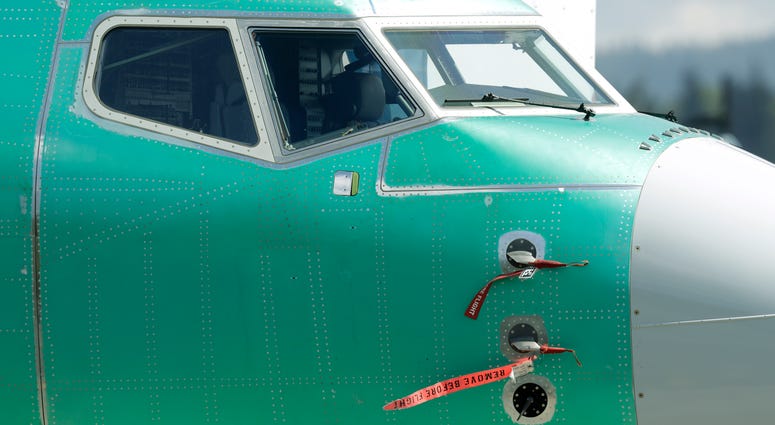 Caution flags are shown on flight sensors on a Boeing 737 MAX 8 airplane being built at Boeing's assembly facility in Renton, Wash. Investigators say many FAA inspectors who worked on standards for the grounded Boeing 737 Max were themselves unqualified. Caution flags are shown on flight sensors on a Boeing 737 MAX 8 airplane being built at Boeing's assembly facility in Renton, Wash.