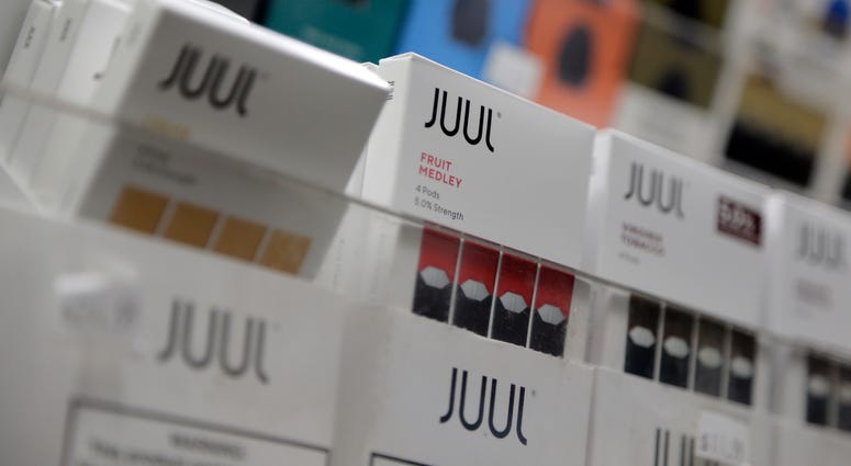In this Dec. 20, 2018, file photo Juul products are displayed at a smoke shop in New York. Juul products