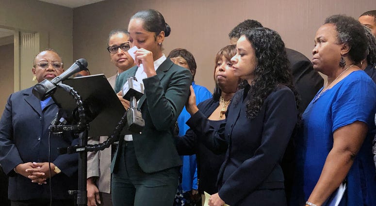Jazmyne Childs cries during a news conference on Wednesday, Sept. 25, 2019, as she describes the sexual harassment she says she endured while employed by the North Carolina chapter of the NAACP, in Raleigh, N.C. Jazmyne Childs cries during a news conference on Wednesday, Sept. 25, 2019, as she describes the sexual harassment she says she endured while employed by the North Carolina chapter of the NAACP, in Raleigh, N.C.