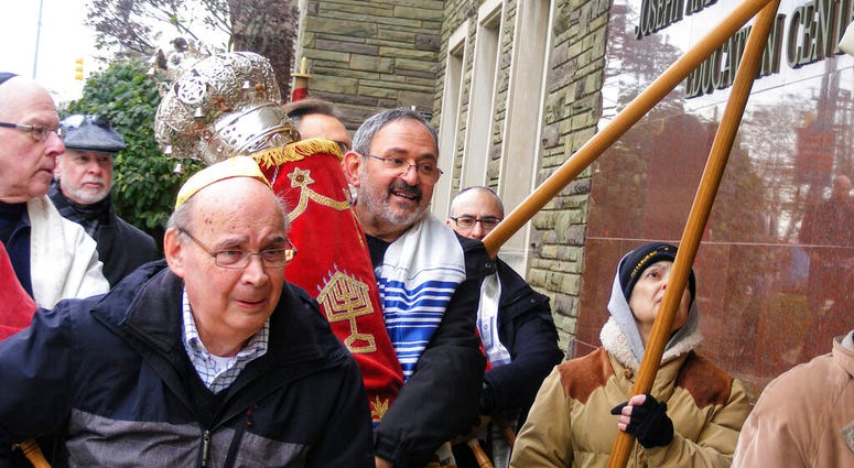 Richard Gottfried carrying a Torah outside the Tree Of Life building in Pittsburgh. Richard Gottfried carrying a Torah outside the Tree Of Life building in Pittsburgh.