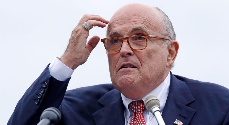 In this Aug. 1, 2018 file photo, Rudy Giuliani, attorney for President Donald Trump, addresses a gathering during a campaign event in Portsmouth, N.H. Rudy Giuliani