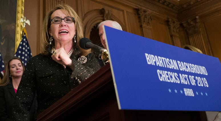 Former Rep. Gabby Giffords, speaks during a news conference to announce the introduction of bipartisan legislation to expand background checks for sales and transfers of firearms, on Capitol Hill in Washington. Former Rep. Gabby Giffords, speaks during a news conference to announce the introduction of bipartisan legislation to expand background checks for sales and transfers of firearms, on Capitol Hill in Washington.