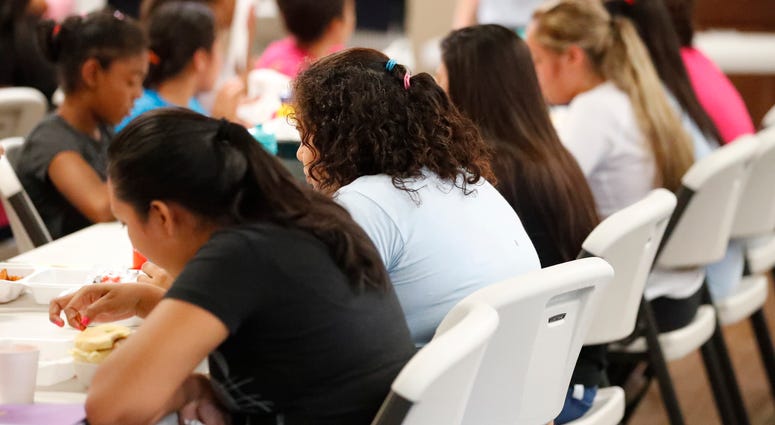 Girls eat lunch at a shelter for migrant teenage girls, in Lake Worth, Fla. Girls eat lunch at a shelter for migrant teenage girls, in Lake Worth, Fla.