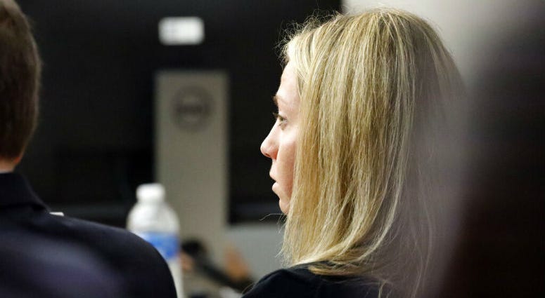 Fired Dallas police officer Amber Guyger listens as friends, family and coworkers speak in her defense during the sentencing phase of her murder trial, Wednesday, Oct. 2, 2019, in Dallas. Fired Dallas police officer Amber Guyger listens as friends, family and coworkers speak in her defense during the sentencing phase of her murder trial/