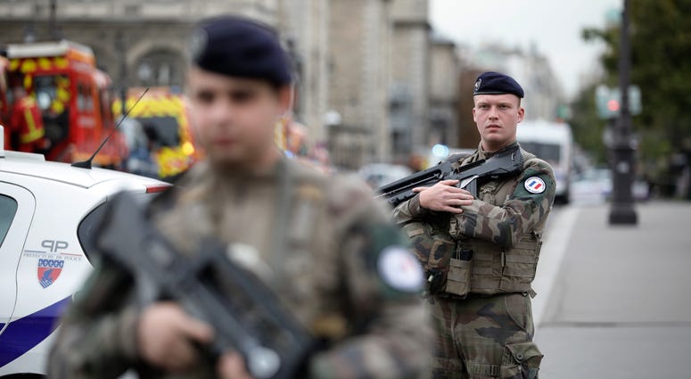 Armed soldiers patrol after an incident at the police headquarters in Paris, Thursday, Oct. 3, 2019. A French police union official says an attacker armed with a knife has killed one officer inside Paris police headquarters before he was shot and killed. Armed soldiers patrol after an incident at the police headquarters in Paris, Thursday, Oct. 3, 2019. A French police union official says an attacker armed with a knife has killed one officer inside Paris police headquarters before he was shot and killed.