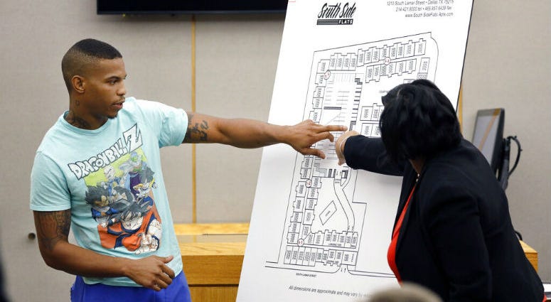 In this Tuesday, Sept. 24, 2019, photo, victim Botham Jean's neighbor Joshua Brown, left, answers questions from Assistant District Attorney LaQuita Long, right. Victim Botham Jean's neighbor Joshua Brown, left, answers questions from Assistant District Attorney LaQuita Long, right