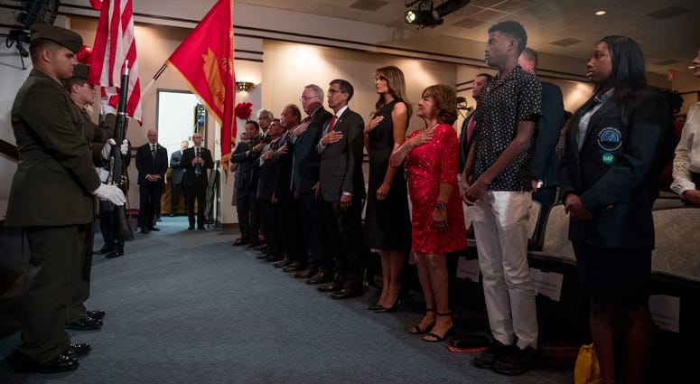 First lady Melania Trump, center, and acting DEA Administrator Uttam Dhillon, center left, stands at a Red Ribbon Rally at the Drug Enforcement Agency in Arlington, Va., Monday, Oct. 7, 2019. First lady Melania Trump, center, and acting DEA Administrator Uttam Dhillon, center left, stands at a Red Ribbon Rally at the Drug Enforcement Agency in Arlington, Va., Monday, Oct. 7, 2019.