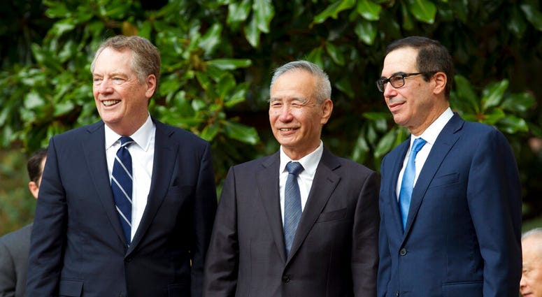 Chinese Vice Premier Liu He accompanied by U.S. Trade Representative Robert Lighthizer, left, and Treasury Secretary Steven Mnuchin, greets the media before a minister-level trade meetings at the Office of the United States Trade Representative in Washing Chinese Vice Premier Liu He accompanied by U.S. Trade Representative Robert Lighthizer, left, and Treasury Secretary Steven Mnuchin, greets the media before a minister-level trade meetings at the Office of the United States Trade Representative in Washing