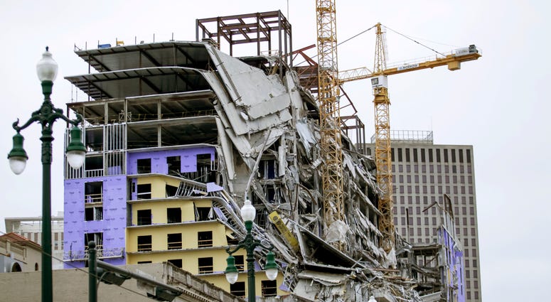 A large portion of the Hard Rock Hotel, under construction, suddenly collapsed in New Orleans on Saturday, Oct. 12, 2019. Several construction workers had to run to safety as the hotel came crashing down. Debris hangs on the side of the building after a large portion of a hotel under construction suddenly collapsed in New Orleans on Saturday, Oct. 12, 2019.