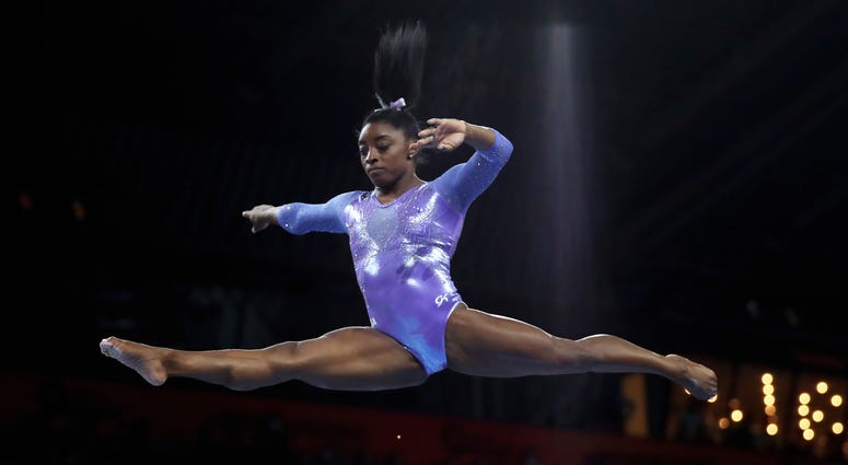 Gold medalist Simone Biles of the United States performs on the balance beam in the women's apparatus finals at the Gymnastics World Championships in Stuttgart, Germany, Sunday, Oct. 13, 2019. Gold medalist Simone Biles of the United States performs on the balance beam in the women's apparatus finals at the Gymnastics World Championships in Stuttgart, Germany, Sunday, Oct. 13, 2019.