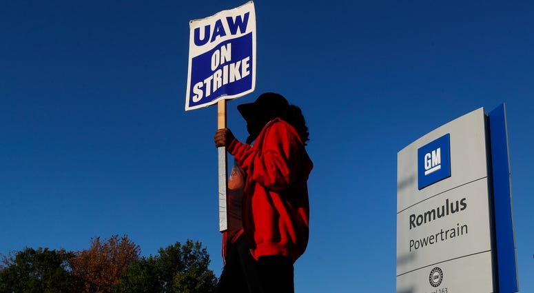 Yolanda Jacobs, a United Auto Workers member, walks the picket line at the General Motors Romulus Powertrain plant in Romulus, Mich. Yolanda Jacobs, a United Auto Workers member, walks the picket line at the General Motors Romulus Powertrain plant in Romulus, Mich.