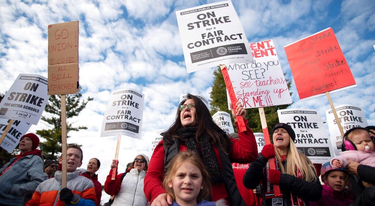 Jennifer Yen, special education teacher at Alexander Graham Bell School, joins the rally as Chicago Public Schools teachers picket, Thursday morning, Oct. 17, 2019, at Lane Tech High School in Chicago. Jennifer Yen, special education teacher at Alexander Graham Bell School, joins the rally as Chicago Public Schools teachers picket, Thursday morning, Oct. 17, 2019, at Lane Tech High School in Chicago.