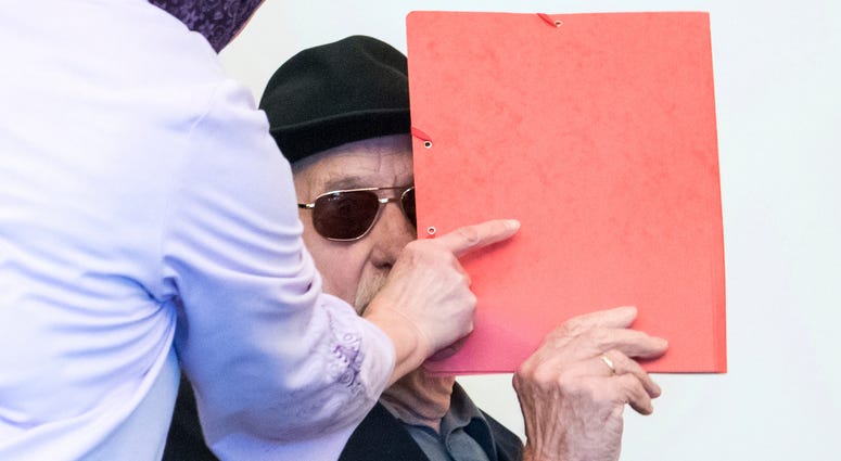 Former SS guard Bruno Dey in the concentration camp Stutthof near Danzig, arrives at the regional court in Hamburg, Germany, Oct. 21, 2019. The prosecution accuses the 93-year-old man of aiding and abetting the murder of 5,230 people. Former SS guard Bruno Dey