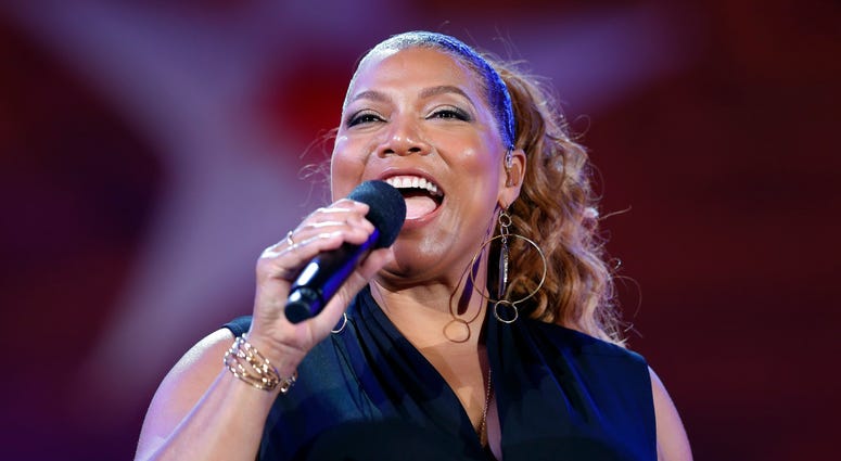 Queen Latifah performs during the dress rehearsal for the Boston Pops Fireworks Spectacular in Boston. Queen Latifah performs during the dress rehearsal for the Boston Pops Fireworks Spectacular in Boston.