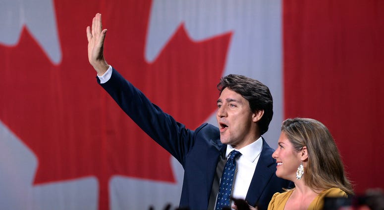 Liberal leader Justin Trudeau and wife Sophie Gregoire Trudeau wave as they go on stage at Liberal election headquarters in Montreal, Monday, Oct. 21, 2019. Liberal leader Justin Trudeau and wife Sophie Gregoire Trudeau wave as they go on stage at Liberal election headquarters in Montreal, Monday, Oct. 21, 2019.
