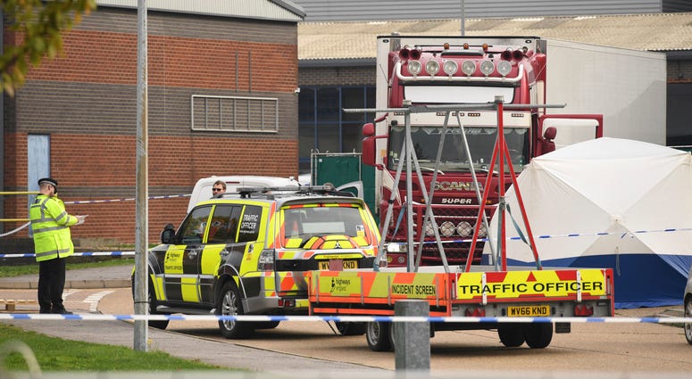 View of a truck, seen in rear, that was found to contain a large number of dead bodies, in Thurrock, South England, early Wednesday Oct. 23, 2019. View of a truck, seen in rear, that was found to contain a large number of dead bodies, in Thurrock, South England, early Wednesday Oct. 23, 2019.